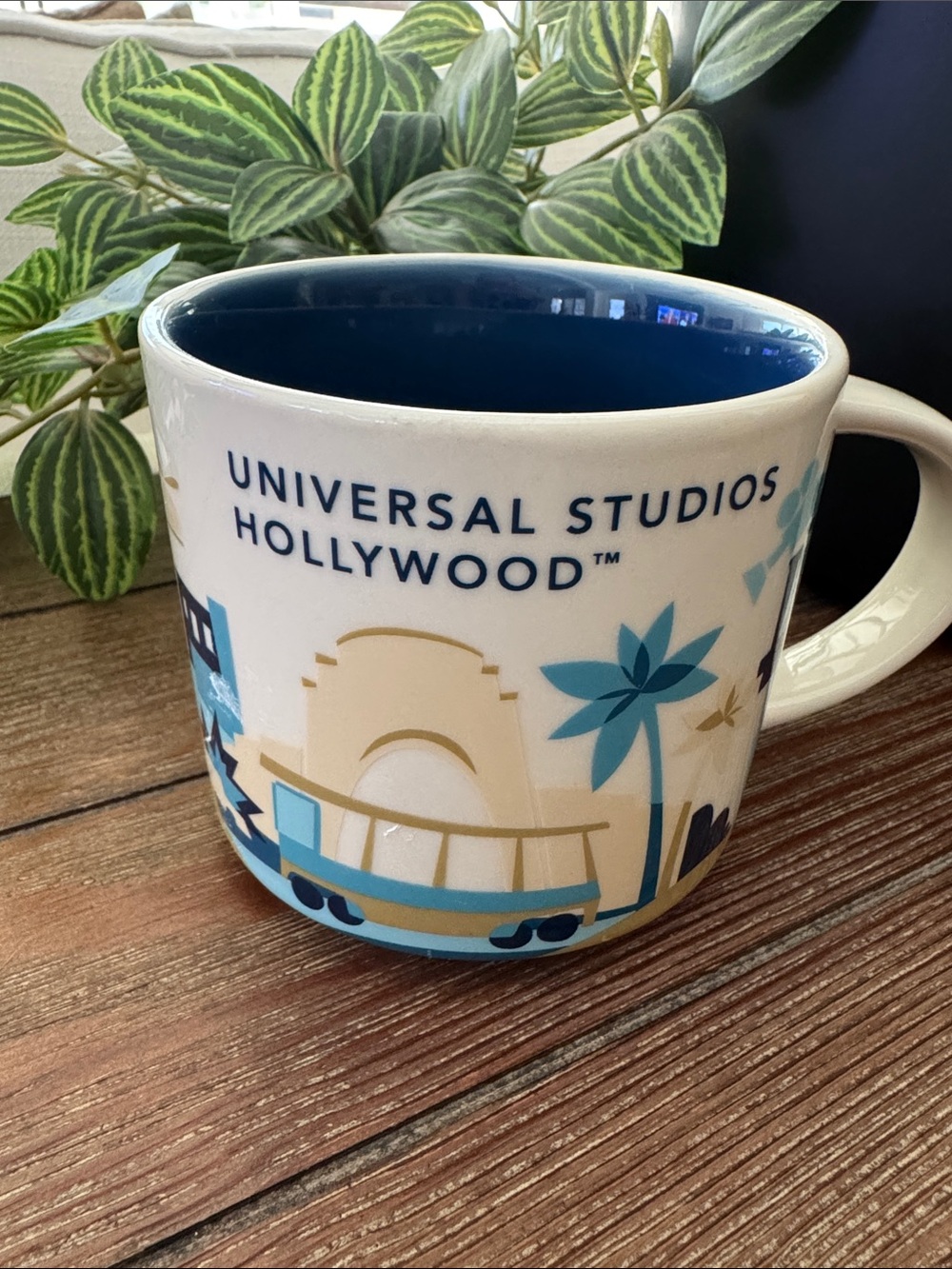 Starbucks Universal Studios White Mug with Blue Interior and Blue-Gold Artwork